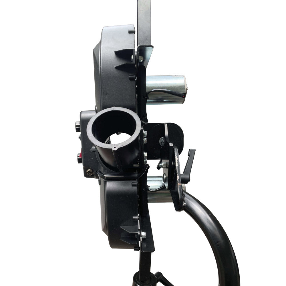A close up of a black battery-operated cricket bowling machine with dual drive wheels.