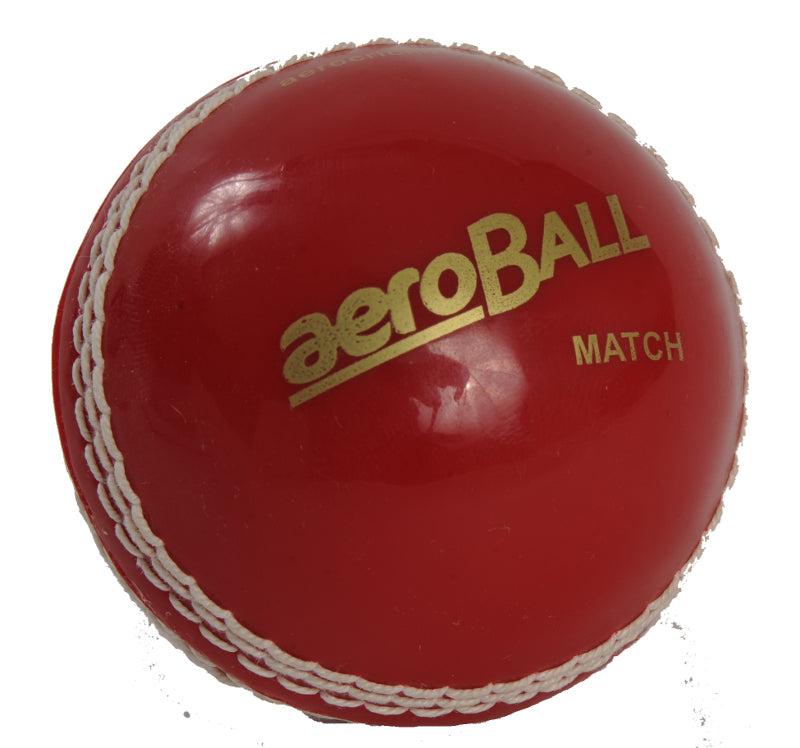 A red plastic cricket ball with the brand name 'aeroBALL' printed in gold lettering.