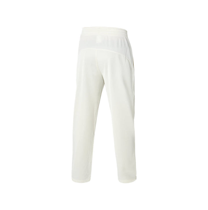 The rear view of a pair of white ASICS playing pants.
