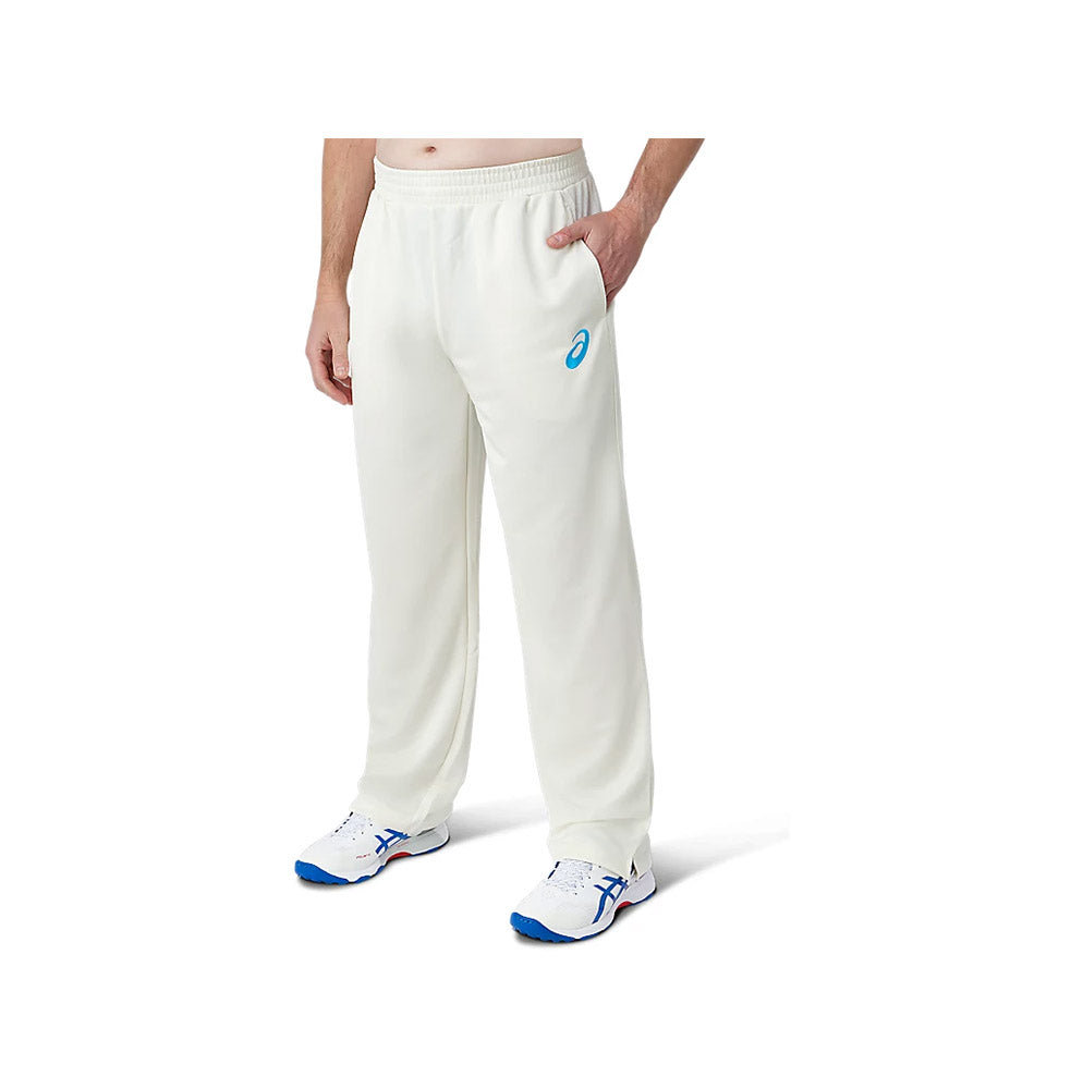 A model wearing the white ASICS cricket playing pants. Showing the two pockets and Asics logo on front.