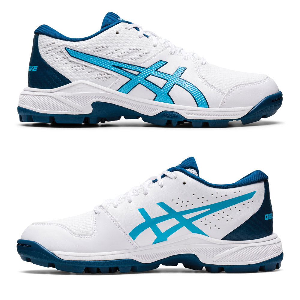 A pair of women's ASICS GEL PEAKE 2 cricket shoes in white and aqua colors, featuring a synthetic upper, AmpliFoam midsole, and rubber outsole.