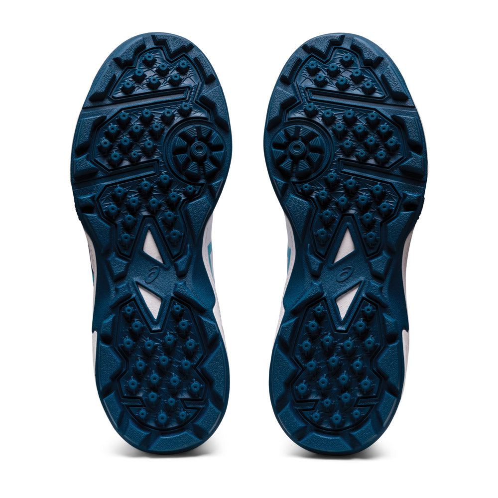 A view of the sole of a pair of women's ASICS GEL PEAKE 2 cricket shoes, showing their rubber outsole.