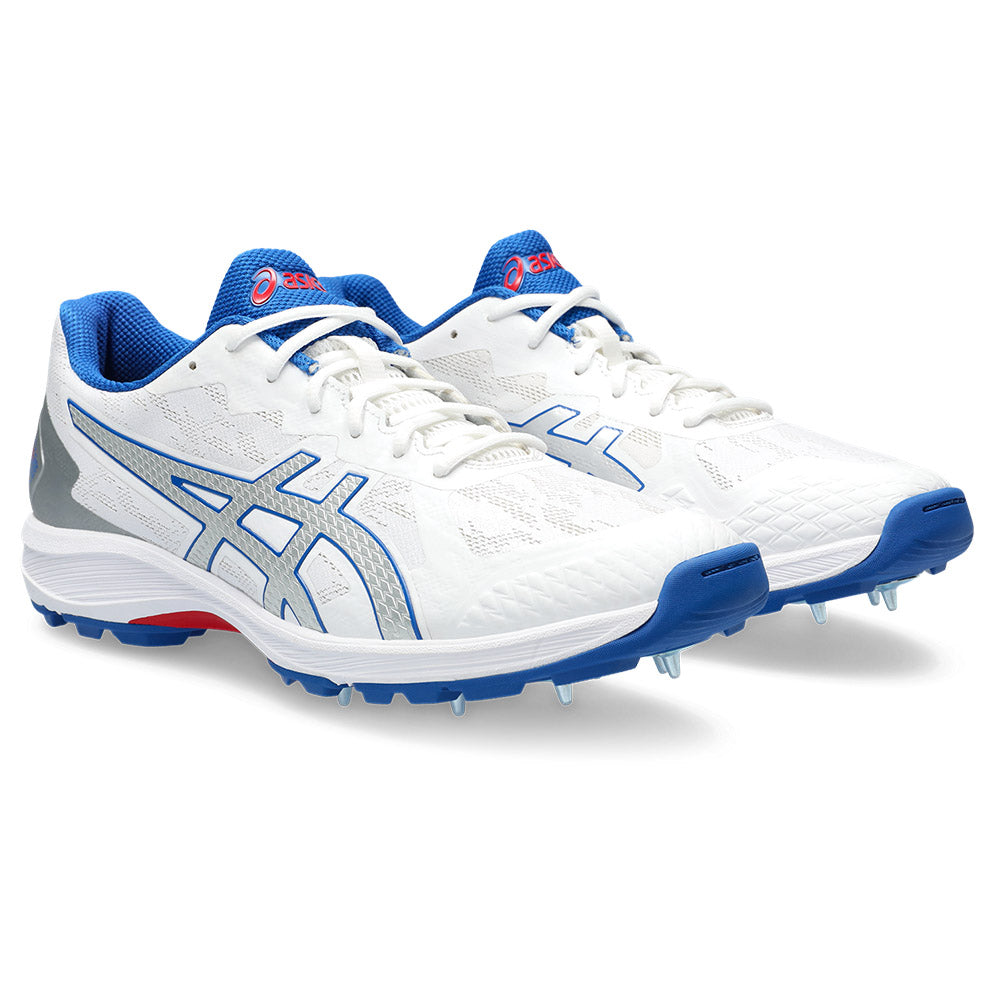 ASICS cricket shoe with white/silver color scheme and blue accents, featuring a spike configuration for traction and a running shoe hybrid design.