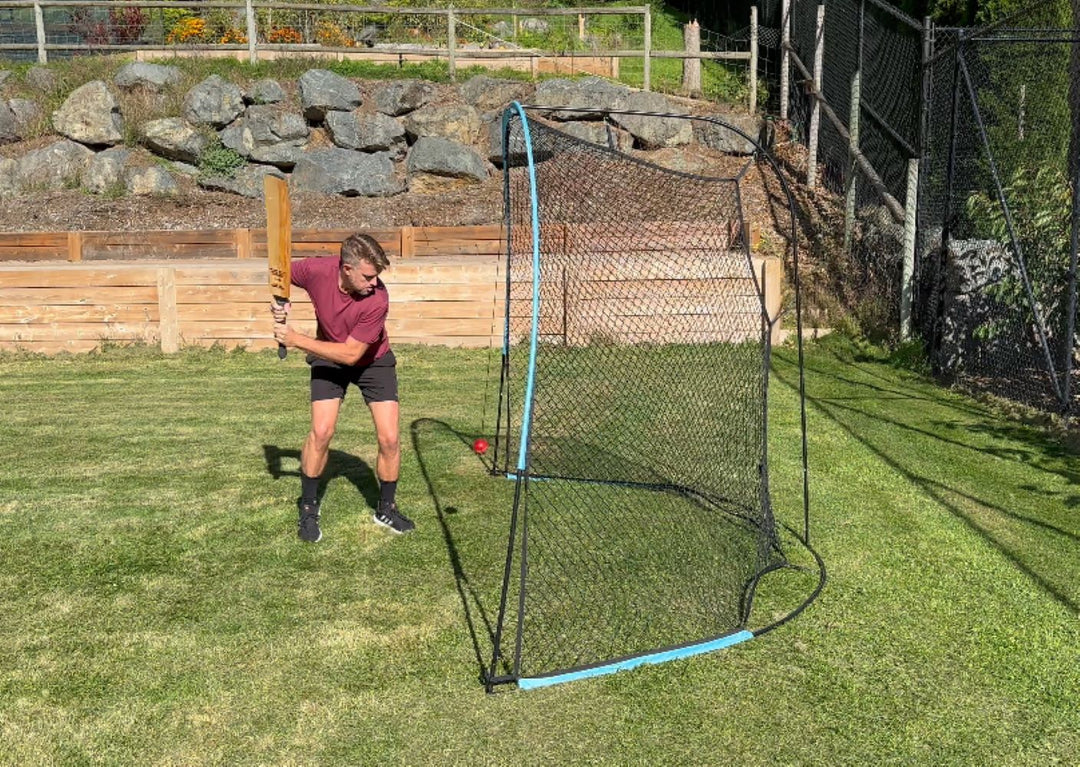 A side profile shot of a cricketer playing shots against the Pitch Concepts Backfire Net.