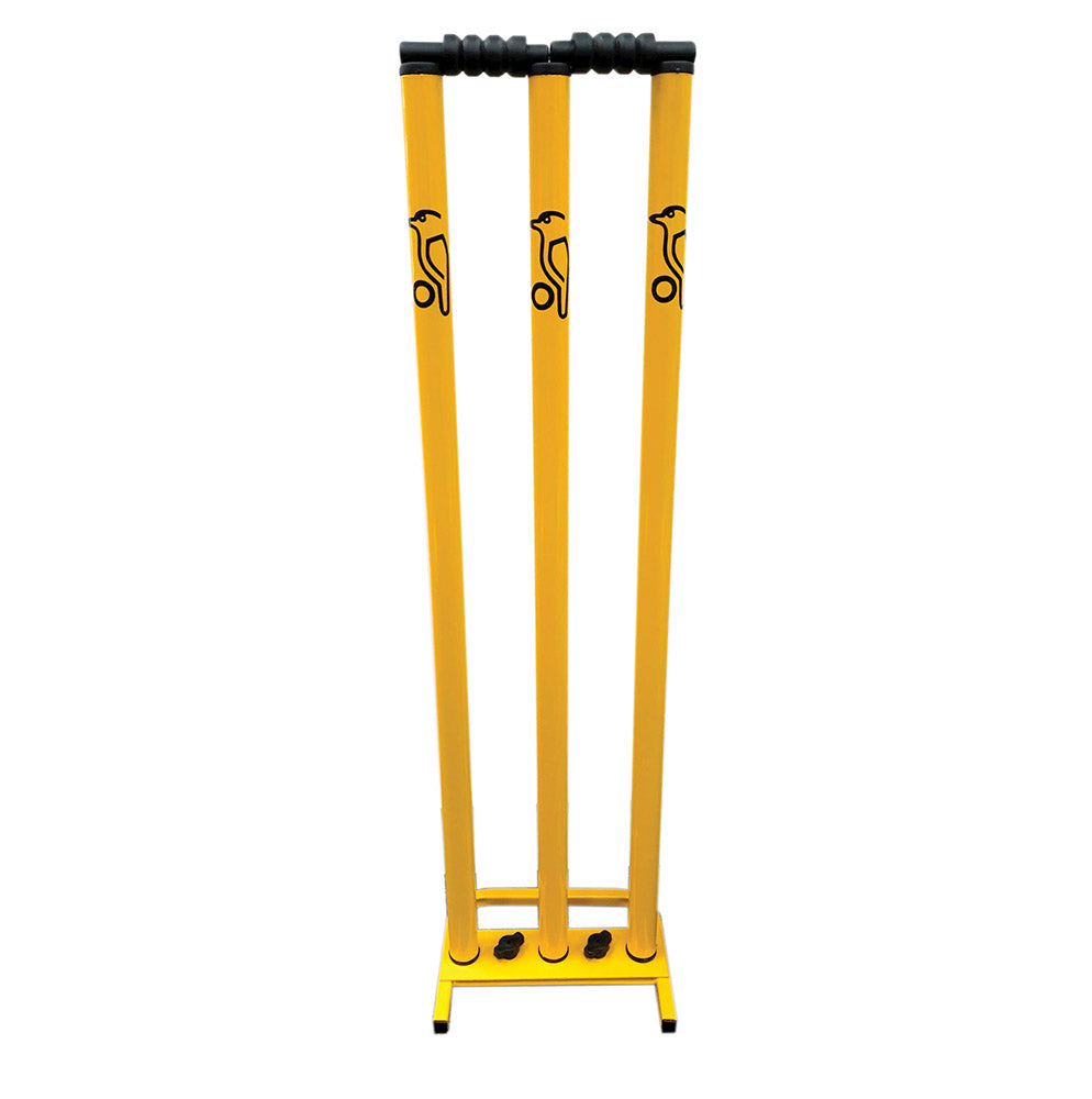 A set of yellow metal cricket stumps with a detachable base, featuring the brand name 'KOOKABURRA' on the stumps.