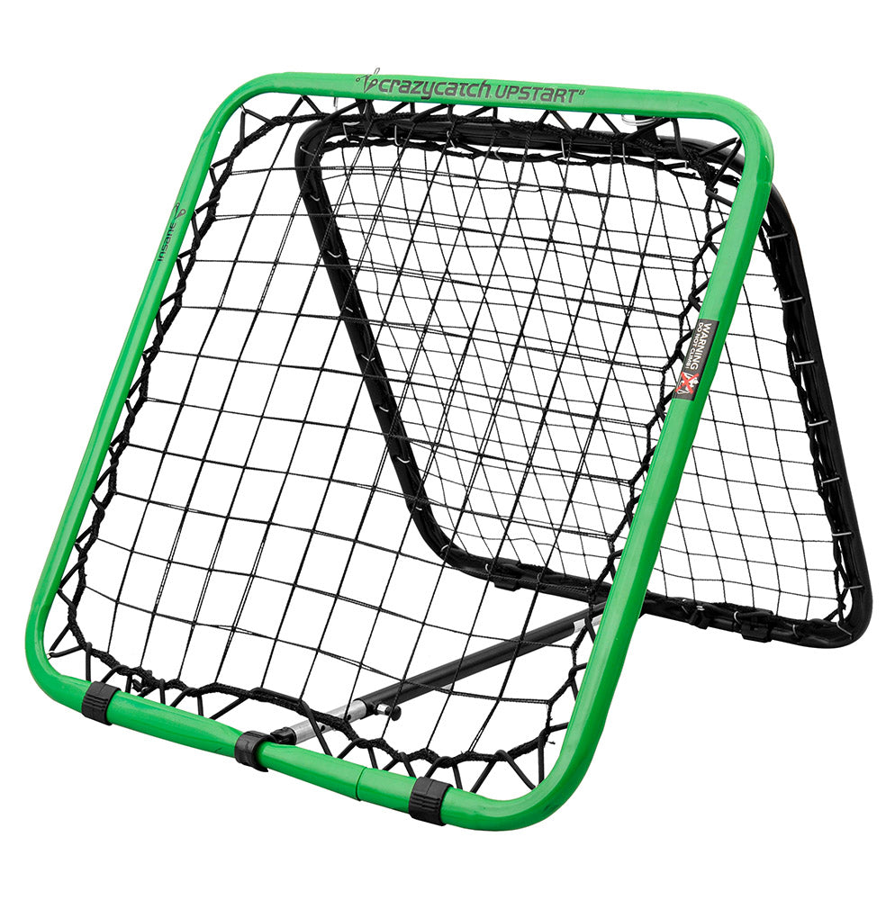 A freestanding Crazy Catch Upstart 2.0 reaction trainer net with a green frame and black netting, designed for sports training.