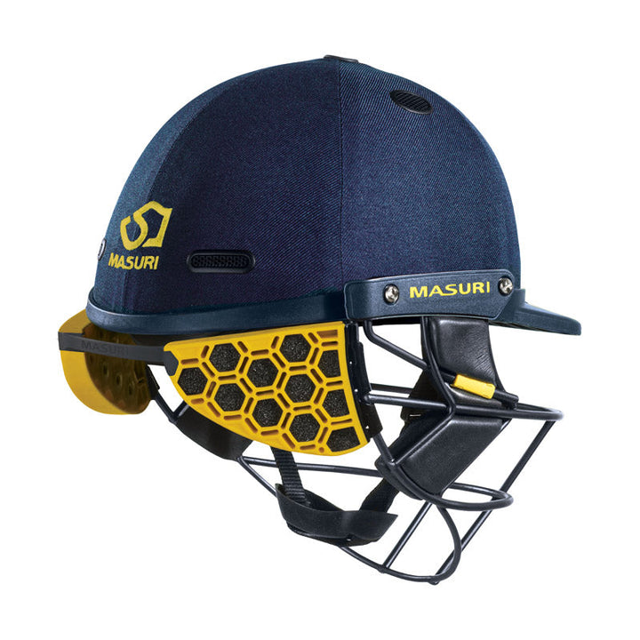Blue Masuri cricket helmet with yellow stem guard and Masuri branding on a white background