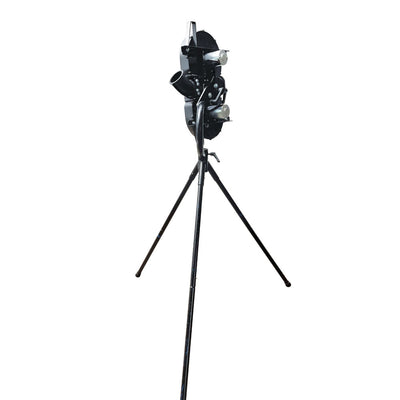 A black battery-operated cricket bowling machine with dual wheels and tripod-style legs, designed for practice and training.