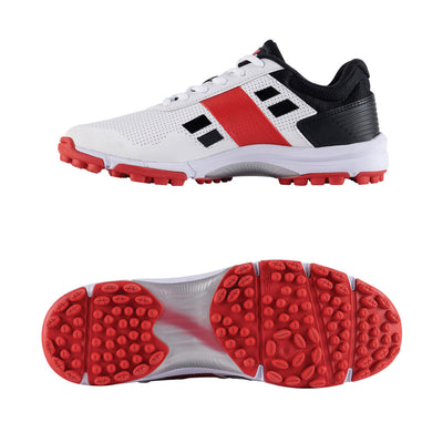 Side and bottom view of GN VELOCITY 4.0 rubber cricket shoes with white upper, red and black accents, and a red rubber outsole with traction patterns.