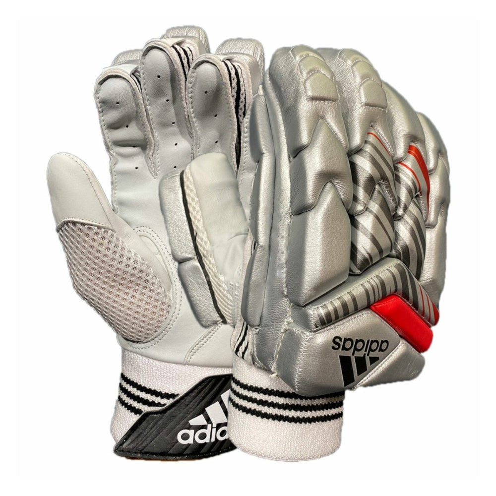 Silver Adidas batting gloves with red accents on a white background